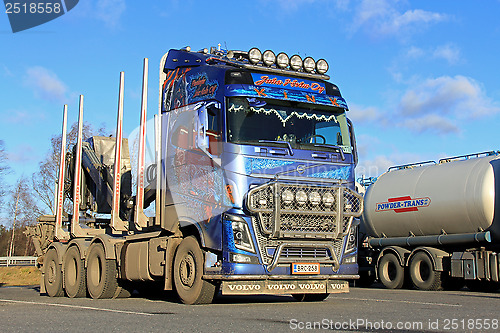 Image of Blue Volvo Logging Truck