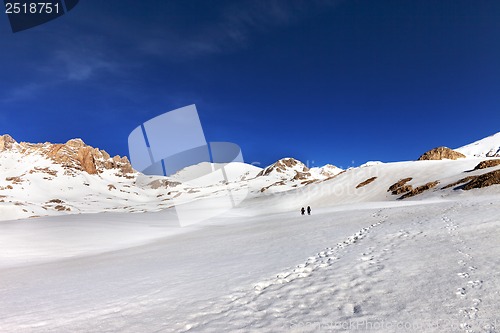 Image of Two hikers on snow plateau