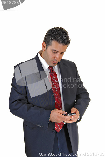 Image of Businessman looking at phone.