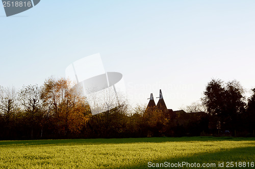 Image of Two oast houses in rural Kent at sundown