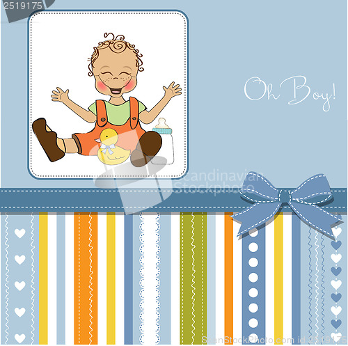 Image of baby boy playing with his duck toy, welcome baby card