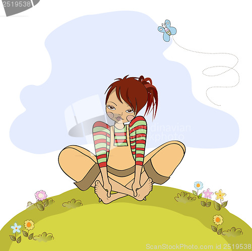 Image of romantic girl sitting barefoot in the grass