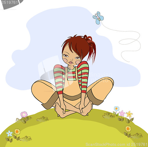 Image of romantic girl sitting barefoot in the grass