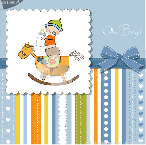 Image of baby boy shower shower with wood horse toy