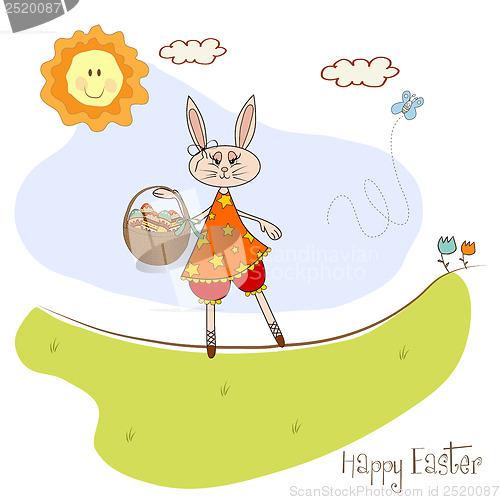 Image of Easter bunny with a basket of Easter eggs