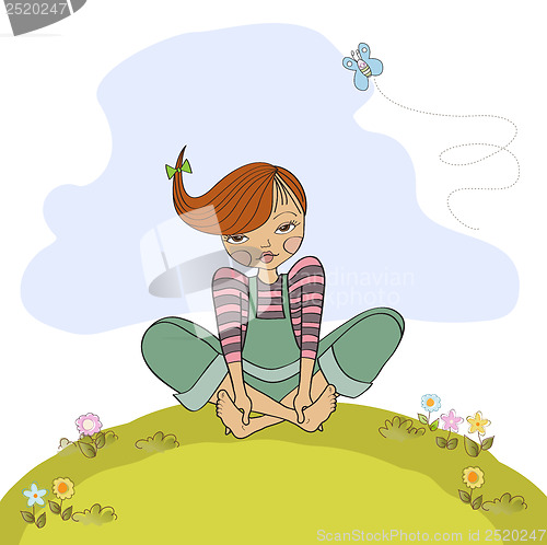 Image of romantic girl sitting barefoot in the grass