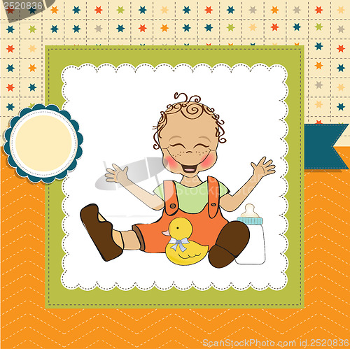 Image of baby boy playing with his duck toy, welcome baby card