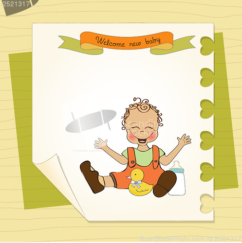 Image of baby boy playing with his duck toy, welcome baby card