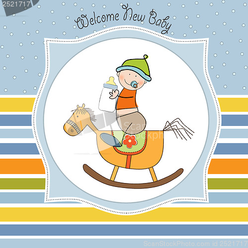 Image of baby boy shower shower with wood horse toy