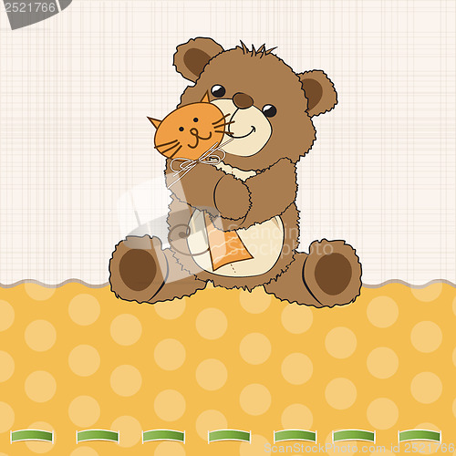 Image of childish greeting card with teddy bear and his toy