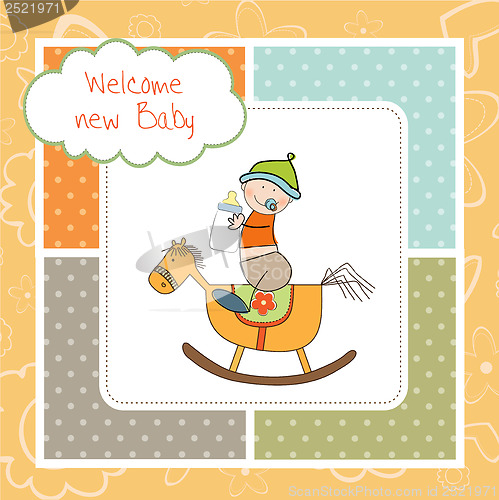 Image of baby boy shower shower with wood horse toy