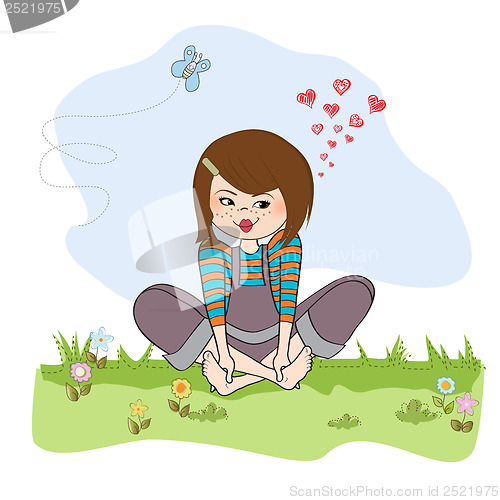 Image of romantic girl sitting barefoot in the grass