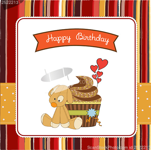 Image of birthday greeting card with cupcake and puppy toy