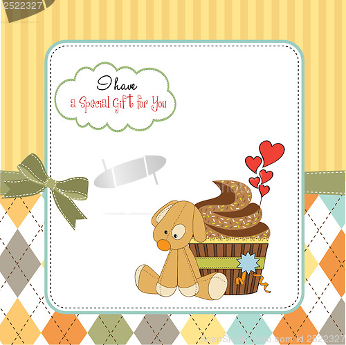 Image of birthday greeting card with cupcake and puppy toy