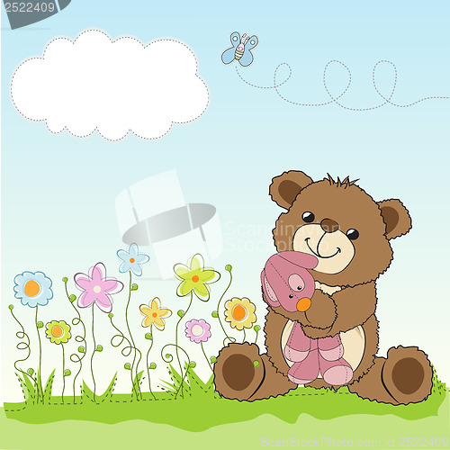 Image of childish greeting card with teddy bear and his toy