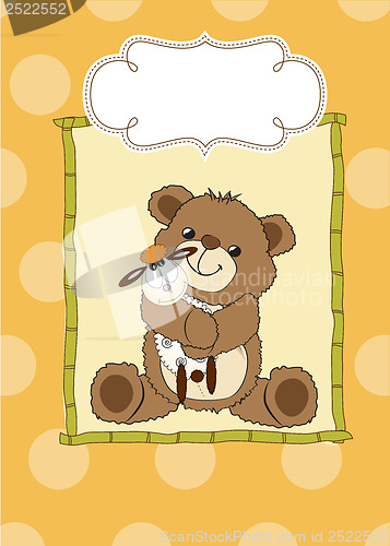 Image of childish greeting card with teddy bear and his toy