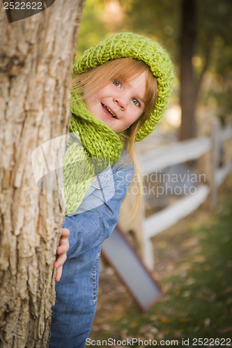 Image of Portrait of Cute Young Girl Wearing Green Scarf and Hat
