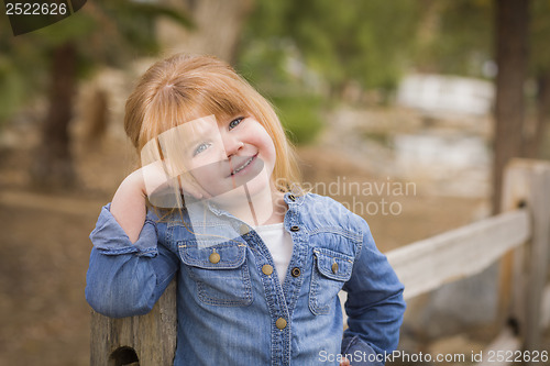 Image of Cute Young Girl Posing for a Portrait Outside