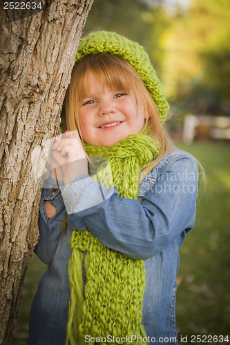 Image of Portrait of Cute Young Girl Wearing Green Scarf and Hat