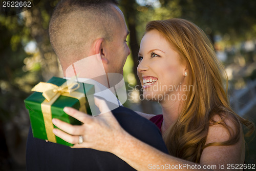 Image of Beautiful Woman and Handsome Military Man Exchange Christmas Gif