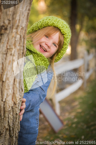 Image of Portrait of Cute Young Girl Wearing Green Scarf and Hat