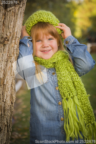 Image of Portrait of Cute Young Girl Wearing Green Scarf and Hat