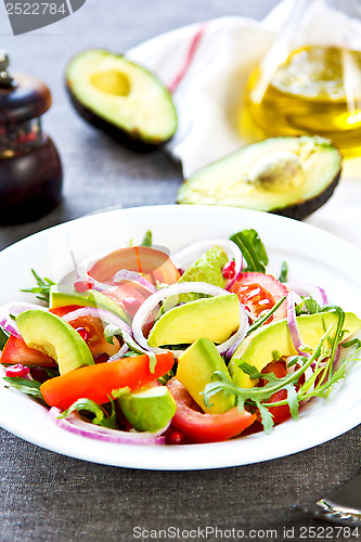 Image of Avocado with Pomegranate and Rocket salad