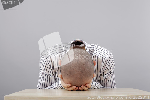 Image of Man at desk