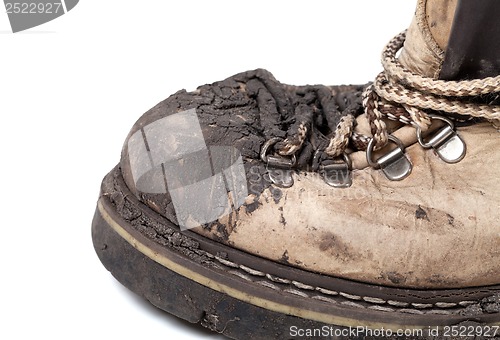 Image of Old dirty trekking boot. Close-up view.