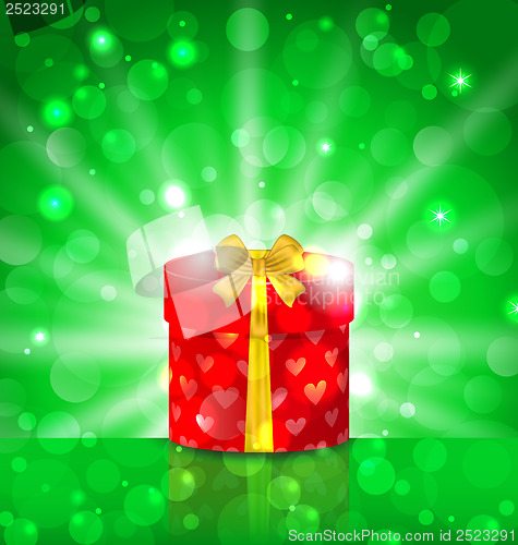 Image of Christmas round gift box on light background with glow