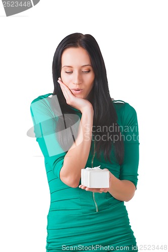 Image of Pretty girl holding white box with gift