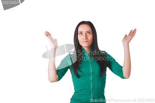 Image of Young woman raising hands to worship