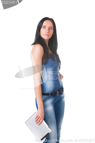 Image of Young girl posing in studio with tablet pc