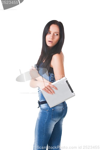 Image of Young girl posing in studio with tablet pc