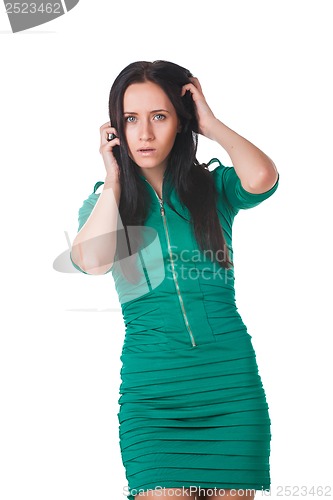 Image of Young girl wearing green dress posing in studio