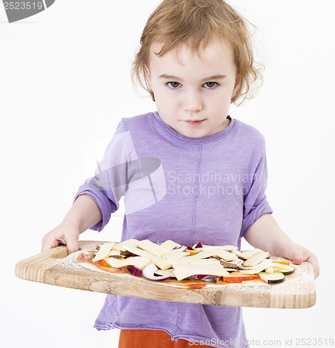 Image of cute girl carrying fresh pizza