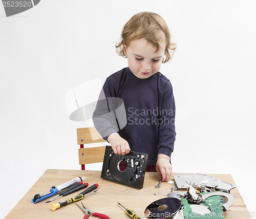 Image of computer parts on wooden desk