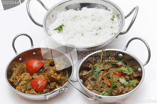 Image of Lamb curries and rice s3erving bowls