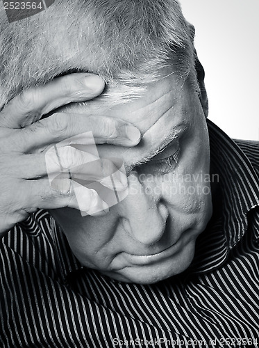 Image of Senior man with a headache