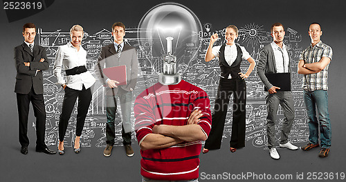 Image of Business Team With Lamp Head