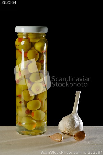 Image of still life with olives and garlic