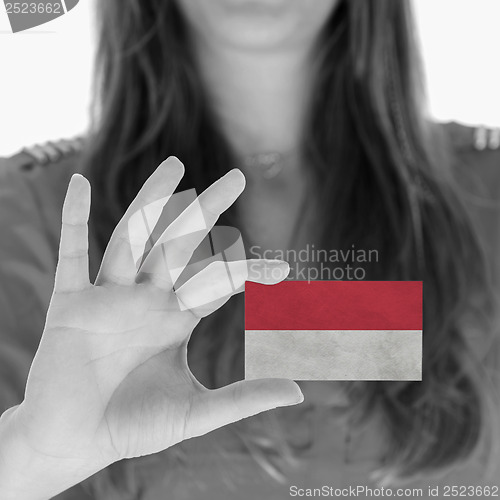 Image of Woman showing a business card