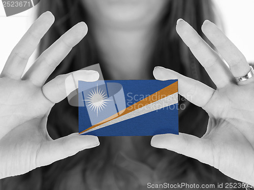 Image of Woman showing a business card