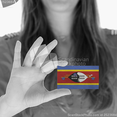 Image of Woman showing a business card