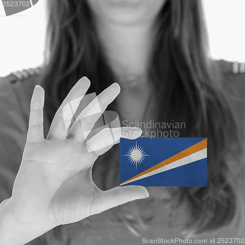 Image of Woman showing a business card