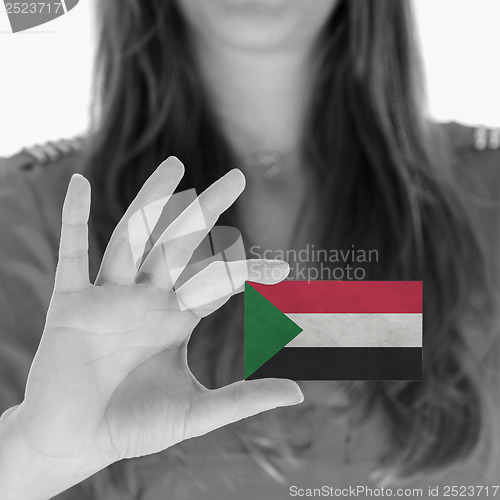 Image of Woman showing a business card