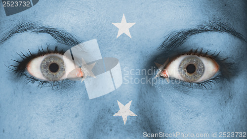 Image of Close up of eyes with flag