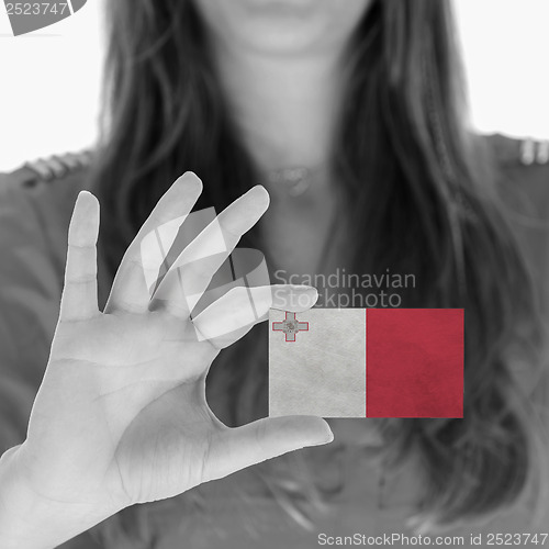 Image of Woman showing a business card