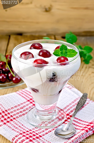 Image of Yogurt thick with cherry on the board