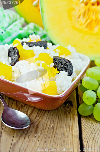 Image of Rice with pumpkin and prunes on the board